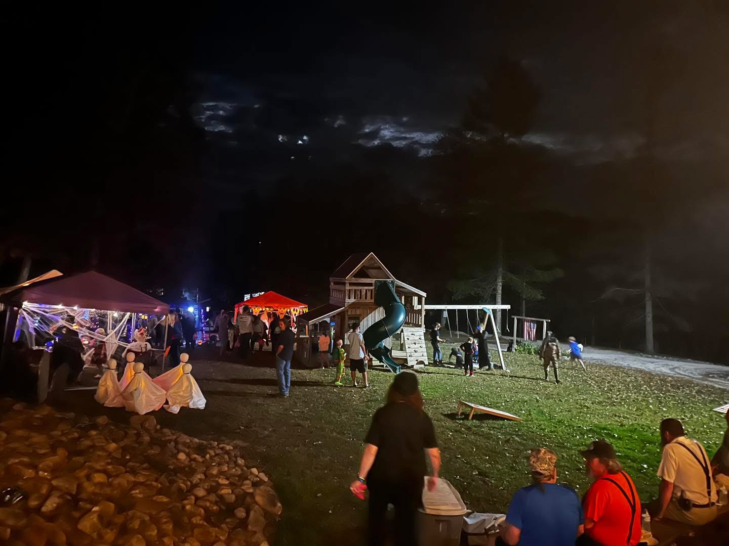 Nighttime club gathering on the lawn at Laurel Creek Campground